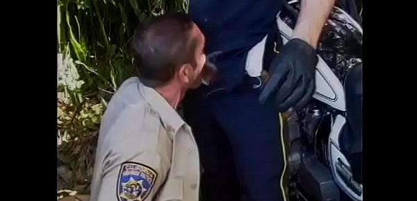  Two stud cops drop their pants and suck each other off